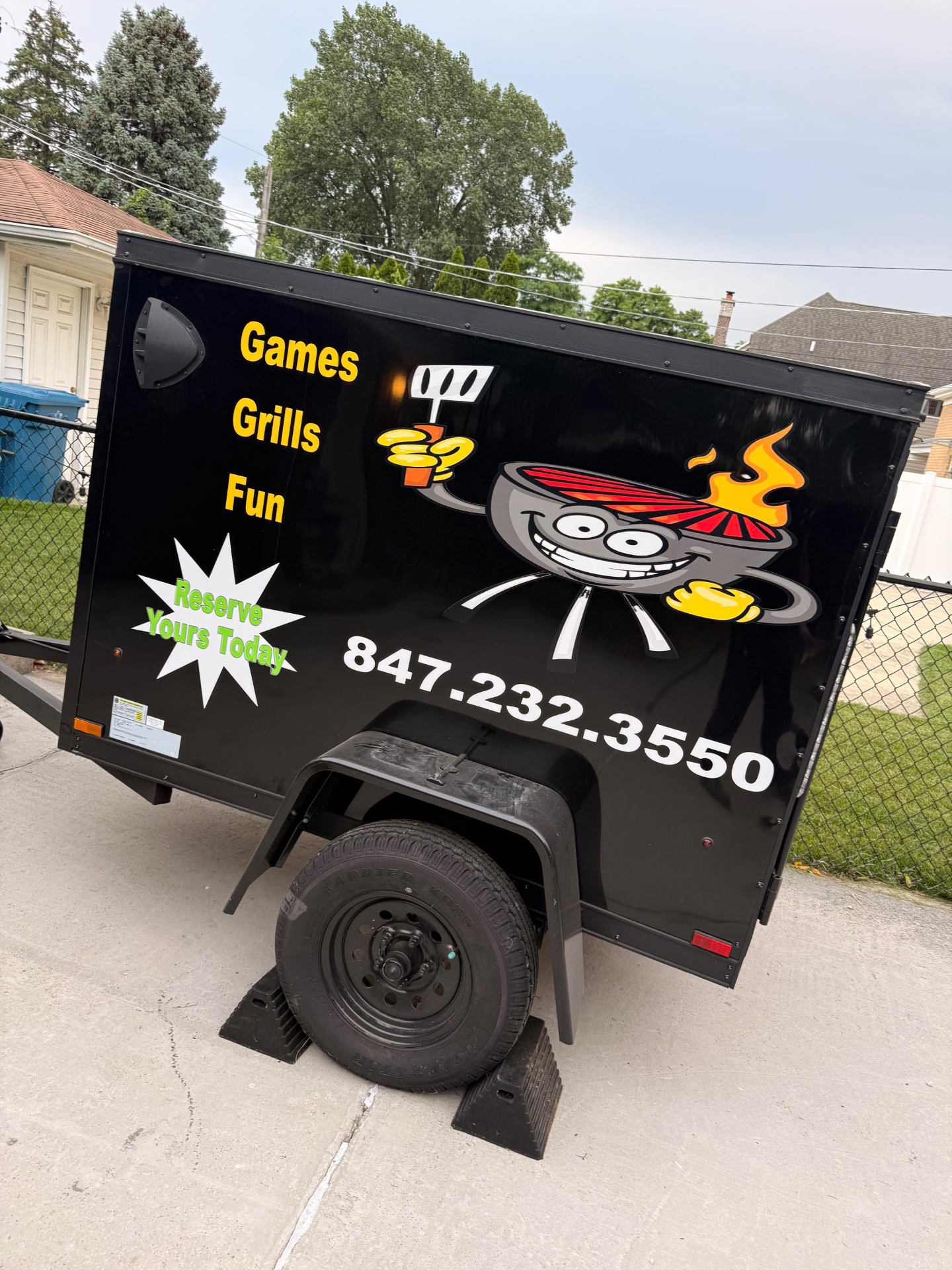 The Games Grills Fun branded mobile trailer parked and ready for an event